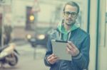 Man On Street Use Ipad Tablet Computer Stock Photo