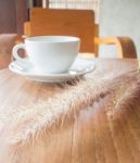 Hot Coffee Cup On Wooden Table Stock Photo