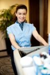 Housekeeping Executive Pushing Cart Stock Photo