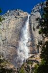 Upper Yosemite Falls Under A Bright Blue Sky Stock Photo