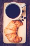 Continental Breakfast With Coffee And Croissant Stock Photo