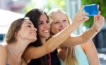 Group Of Friends Taking Selfie In The Street Stock Photo