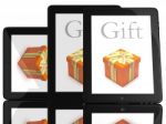 Tablet Computer With Gift Stock Photo