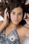 High Angle View Of High Angle View Of Laying Woman With Headphone Stock Photo