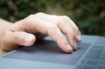 Woman Hand Using Laptop Touchpad Stock Photo