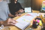 Two Young Women Working As Fashion Designers And Drawing Sketche Stock Photo