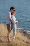 Portrait Of Asian Younger Man And Woman Relaxing Vacation At Sea Side Happiness Emotion Stock Photo