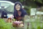 Asian Woman Relaxing Happiness Emotion Planting Organic Vegetable In Home Garden Stock Photo