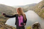 Young Girl Near River Taking Selfie Stock Photo