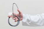 Doctor Holding Stethoscope Stock Photo