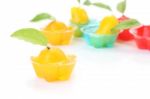 Orange Deletable Imitation Fruits In Jelly Cup On White Floor Stock Photo