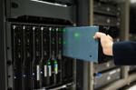 People Fix Server Network In Data Room Stock Photo