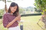 Portrait Of Young Beautiful Woman Reading Message Text On Mobile Stock Photo