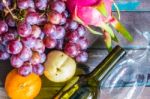 Many Fruits On A Wooden Floor Stock Photo