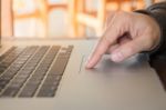 Woman's Hand Using Touch Pad Of Laptop Stock Photo