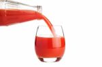 Tomato Juice Is Flowing Into A Glass Isolated On White Stock Photo