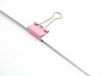 Pink Paperclip Attached On White Paper Isolated Stock Photo