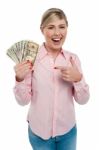 Pretty Woman Holding Up Dollar Notes Stock Photo