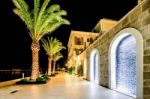 Palm Trees And The Buildings In The Night Lights In Marina Porto Montenegro, Tivat, Montenegro Stock Photo