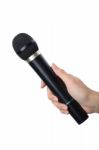 Hand With Black Microphone Isolated On White Background Stock Photo