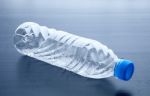 Empty Plastic Bottle Lying On Gray Background Stock Photo