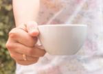 Hand On Cup Of Coffee With Vintage Filter Stock Photo