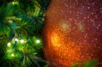 Close Up Big Red Glitter Ball Christmas On Tree With Wire White Light Background Stock Photo