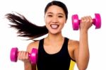 Happy Fitness Woman Lifting Dumbbells Stock Photo