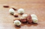 Almonds On Wooden Floor Stock Photo