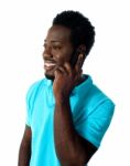 African Guy Talking Over Phone Stock Photo