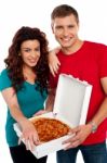 Smiling Couple Holding Pizza Box Stock Photo