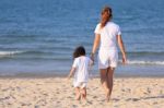 Asian Family On Beach Stock Photo