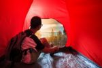 Camping Man In Camper Tent Looking To Beautiful Natural Scenic Use For People Vacation Traveling To Destination Stock Photo