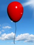 Red Balloon Flying In Sky Stock Photo