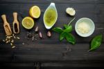 The Ingredients For Green Pesto Sauce On Dark Wooden Background Stock Photo