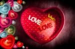 Heart-shaped Gift Box And Text "love" In Box On Dark Background Stock Photo