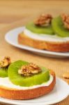 Toast With Kiwi, Cheese And Walnuts Stock Photo