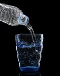 Freshness Cool And Clean Drinking Water Pouring To Blue Glass Is Stock Photo