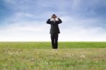 Businessman Using Binoculars Stock Photo