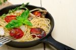 Spaghetti Pasta With Baked Cherry Tomatoes And Basil Stock Photo