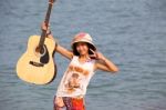 Young Woman With Guitar Stock Photo