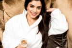 Beautiful Lady In Bathrobe Enjoying Her Drink Stock Photo