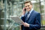 Businessman Talking On The Mobile Phone Stock Photo