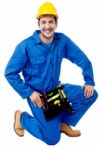 Seated Construction Worker Posing With A Smile Stock Photo