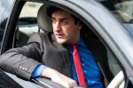 Handsome Man Driving His New Car Safely Stock Photo