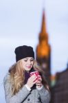 Attractive Young Stylish Blonde Girl Drinks Hot Drink From A Mug Stock Photo