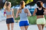 Group Of Women Running In The Park Stock Photo