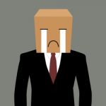 Cardboad Businessman With A Crying Face Stock Photo