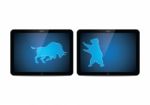 Stock Market Bull And Bear Tablet Stock Photo