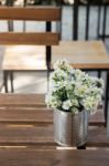 Vintage White Flower Pot On Wooden Table Stock Photo